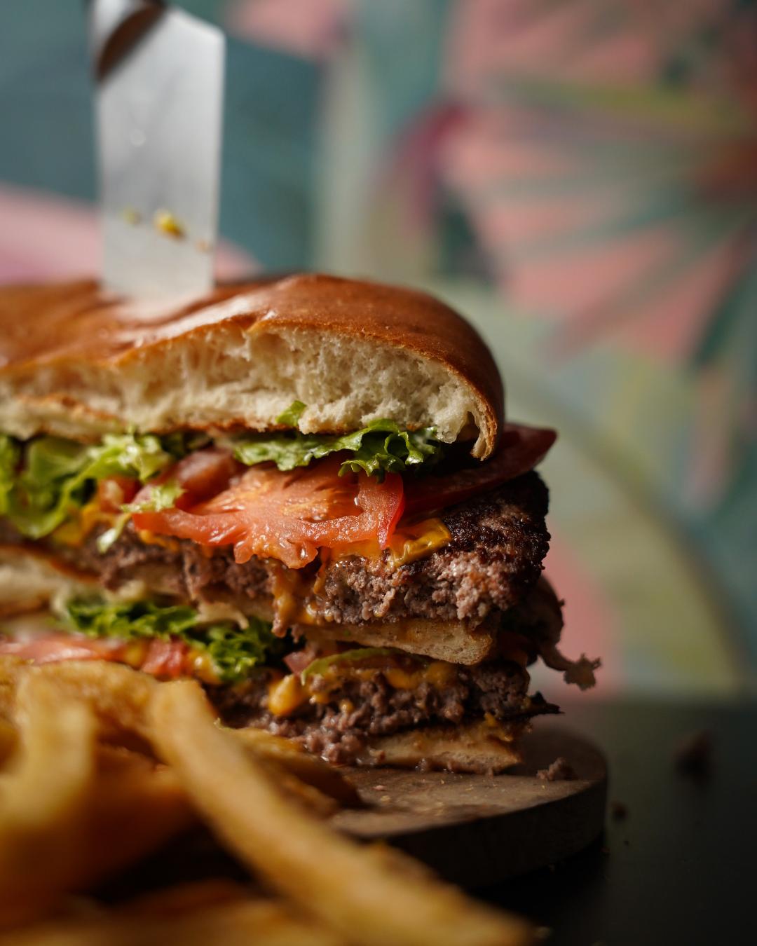 A professional food photography shot of a main course dish at an Adelaide venue, overhead angle